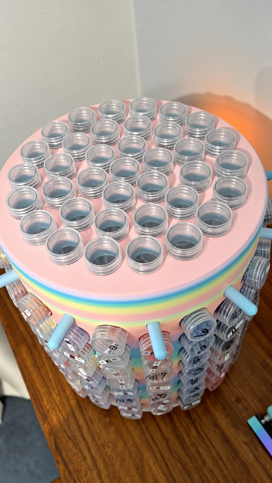 Top view of OGK 204-capacity spinning bead jar tower showing upright jars on top and labeled jars around the sides
